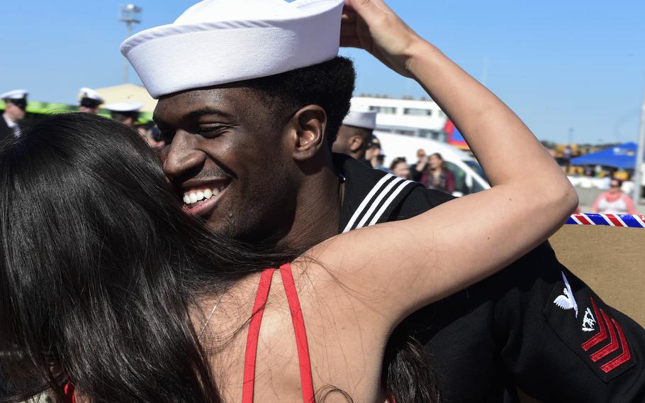 Petty Officer 1st Class Daniel Rainmaker, a fire controlman, hugs his wife after the USS Carney returned March 13, 2016, to Naval Station Rota, Spain. The Arleigh Burke-class guided-missile destroyer had been conducting a routine patrol in the U.S. 6th Fleet area of operations.