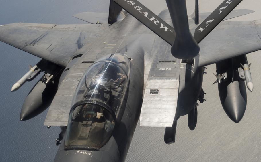 An F-15 fighter supporting air operations against the Islamic State group in Iraq and Syria refuels from a KC-135 Stratotanker over the Persian Gulf on March 24, 2016.