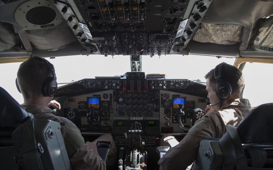 KC-135 Stratotanker aircraft commander and pilot Maj. Joe, left, and co-pilot 1st Lt. Scott fly the aircraft and maintain radio communications throughout their refueling mission on March 24, 2016, in support of the air campaign against the Islamic State in Iraq and Syria. Crewmembers could not be identified by their full names for security reasons.