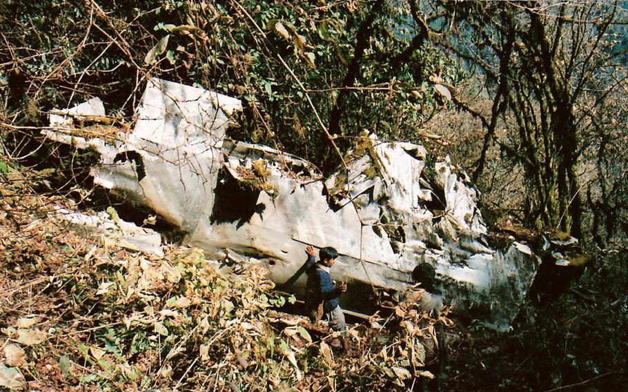 The final resting place of "Hot as Hell," a B-24 Liberator heavy bomber from the 308th Bombardment Group, 425th Squadron that went down Jan. 25, 1944. The crash site, where the wing section and engines are visible, is about 9,400 feet up the outer Himalayas in northeastern India, near China, about a three-day climb from a village called Damroh.