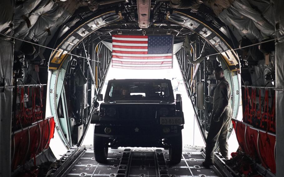 A Japan Ground Self-Defense Force military utility vehicle drives into a U.S. Air Force C-130 Hercules from Yokota Air Base, Japan Tuesday, April 19, 2016 in Chitose, Japan. Yokota's airmen have delivered six vehicles and several JGSDF personnel deploying to Kumamoto, Japan.