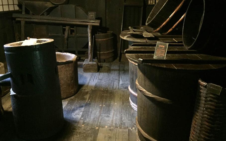 Barrels used for fermenting miso fill a room at the Yanohara family house at Sankeien in Yokohama.