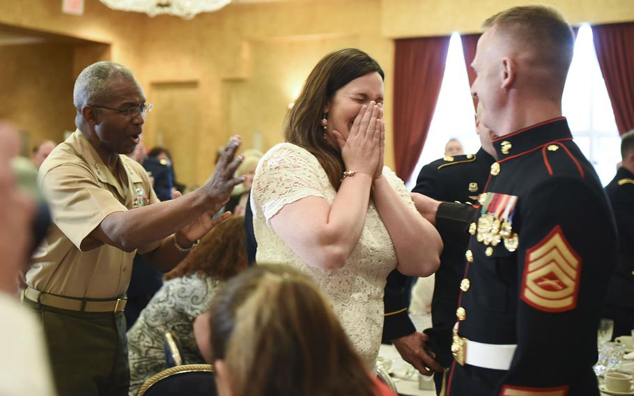 Natasha Harth reacts to being named The 2016 Armed Forces Insurance Military Spouse of the Year during an awards luncheon Thursday, May 5, 2016, at Fort Myer, Va. At right is Harth's husband, Gunnery Sgt. Patrick Harth.
