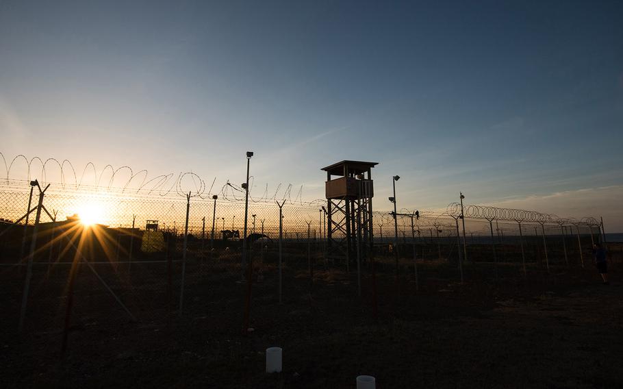 The sun rises the morning of April 19, 2016 over Camp Delta at Guantanamo Bay, Cuba. Camp Delta, along the coast on the Windward Point side of the naval base, once housed law of war detainees. Today it includes a medical facility and a library.