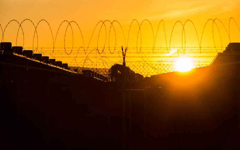 The sun rises April 19 over Camp Delta at Guantanamo Bay, Cuba.