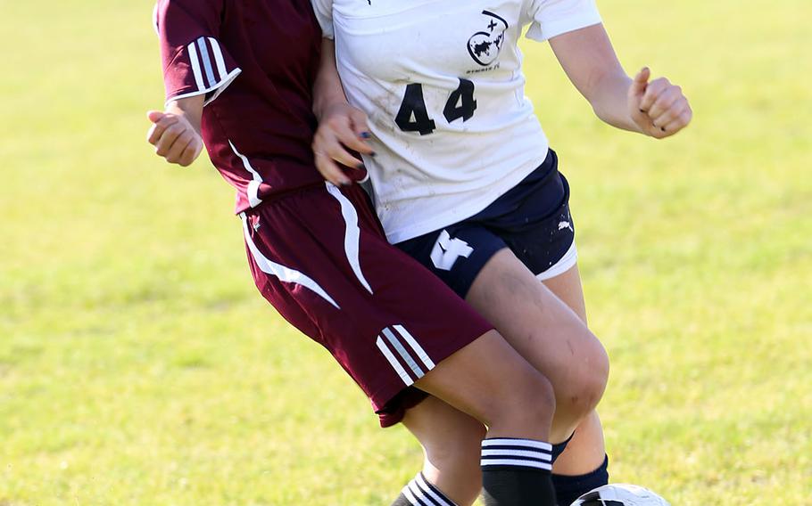 Perry's Vanessa Aguilar and Sacred Heart's Miya Bernal scuffle for the ball during Tuesday's pool-play match in the Far East Division II Girls Soccer Tournament, won by the Samurai 3-0.