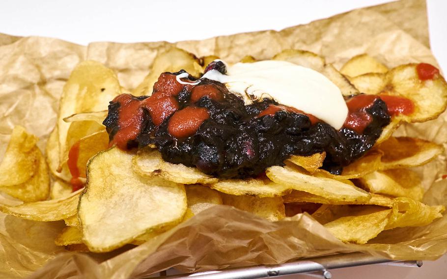 The Black Chili Chips are the new and confusing "Ghostbusters"-inspired menu item at J.S. Burgers Cafe. The chips are topped with a squid ink infused chili with a white cheddar and tomato puree sauce.