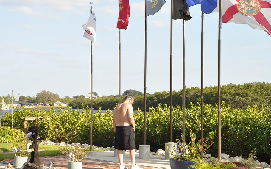 A visitor takes a reflective moment at My Warriors Place, a veterans place of healing in Ruskin, Florida. Kelly Kowall created My Warrior's Place in memory of her son Corey, who was killed in action in Afghanistan in 2009.