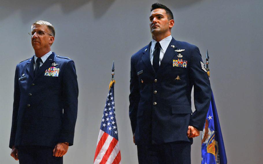 Tech. Sgt. Daniel Warren, right, a pararescueman with the 920th Rescue Wing, received a Bronze Star with "V" device for valor for his actions during a 2012 insurgent attack on Bastion Airfield, Afghanistan. Warren stands next to 920th Rescue Wing Commander Col. Jeffrey Macrander during the award ceremony at Patrick Air Force Base in Florida on March 2, 2014. 