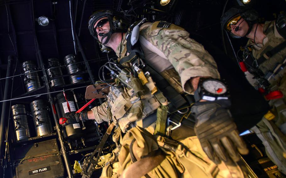U.S. Air Force Tech. Sgt. Daniel Warren, a pararescueman jump master assigned to the 82nd Expeditionary Rescue Squadron, prepares for a static line jump near Camp Lemonnier, Djibouti, on Jan. 9, 2014.