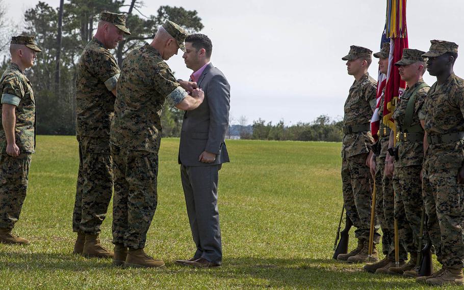 Matthew Parker, a retired Marine Corps infantry sergeant, receives the Silver Star in March 2016 at Camp Lejeune, N.C., for his actions in Afghanistan's Helmand province in 2011.