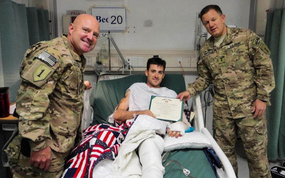 Sgt. Andrew Mahoney receives his Purple Heart after being injured in a suicide bomber attack in Asadabad, Afghanistan, on Aug. 8, 2012.