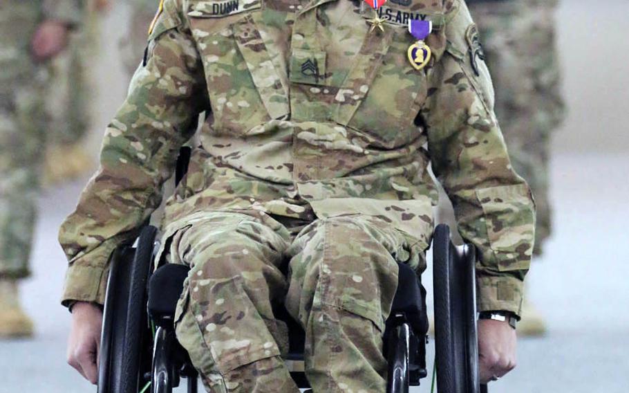 Staff Sgt. Travis D. Dunn, Bravo Company, 1st Battalion, 75th Ranger Regiment, is awarded the Bronze Star with "V" device for valor during a 2015 ceremony at Hunter Army Airfield, Savannah, Ga. Dunn was wounded during a six-hour firefight in Nangarhar province, Afghanistan, in 2014. 