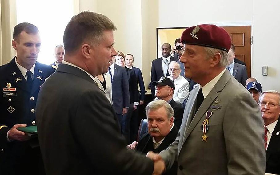 Congressman Chris Gibson presents the Silver Star to Vietnam veteran Army Spc. Stanley DeRuggiero Jr. on April 14, 2016, on Capitol Hill. DeRuggiero, who served with the Army's 173rd Airborne Brigade, rescued three badly wounded paratroopers while exchanging fire with the enemy near Bao Loc, Vietnam, on June 17, 1968.
