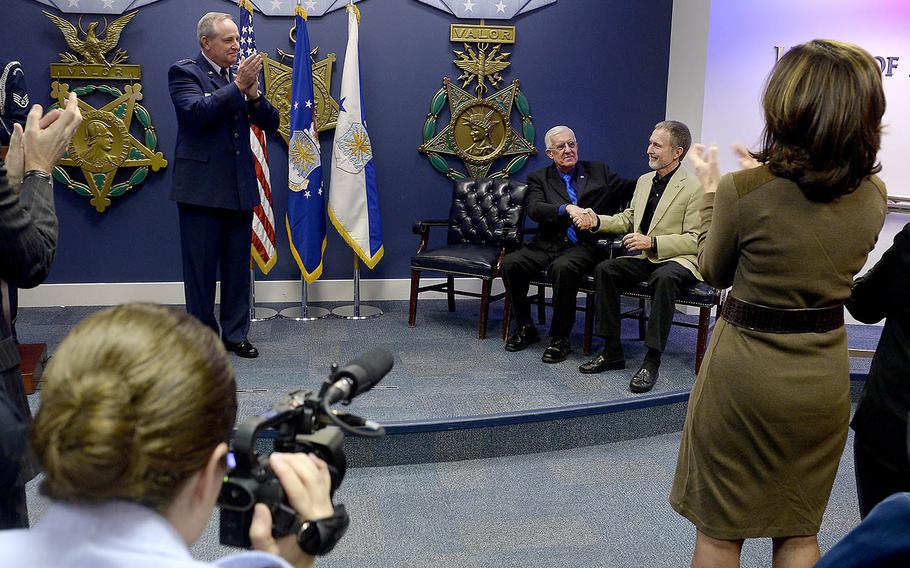 Air Force Chief of Staff Gen. Mark A. Welsh III presents the Silver Star to retired Chief Master Sgt. Ronald W. Brodeur and former Sgt. Eric L. Roberts II during a Pentagon ceremony Dec. 17, 2015.  Brodeur and Roberts received their medals for their gallant action in Cambodia on Feb. 20, 1969, while assigned to the 20th Special Operations Squadron known as the Green Hornets.