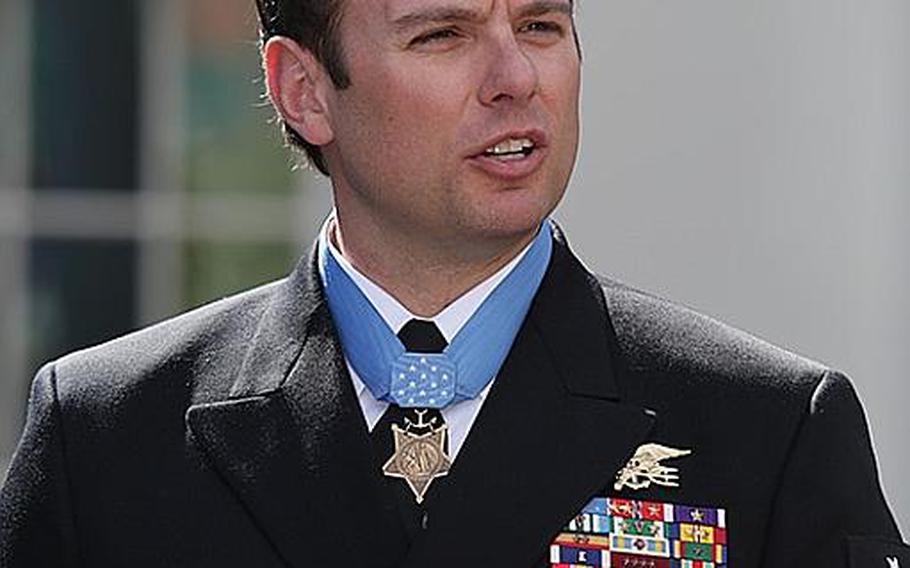 Senior Chief Petty Officer Edward C. Byers Jr. speaks to media after receiving the Medal of Honor during a ceremony Feb. 29, 2016, at the White House. He praised his friend, Navy Petty Officer 1st Class Nicolas Checque, who was killed in the hostage rescue in 2012. 