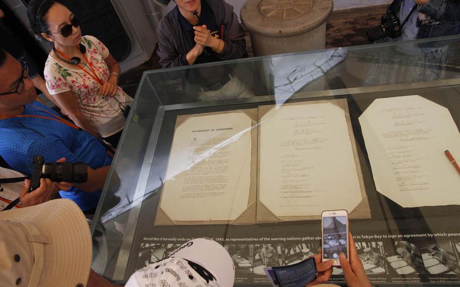 Copies of Japan's formal surrender agreement from World War II are displayed in a glass case near where the original was signed on Sept. 2, 1945, which brought an end to almost five years of war in the Pacific.