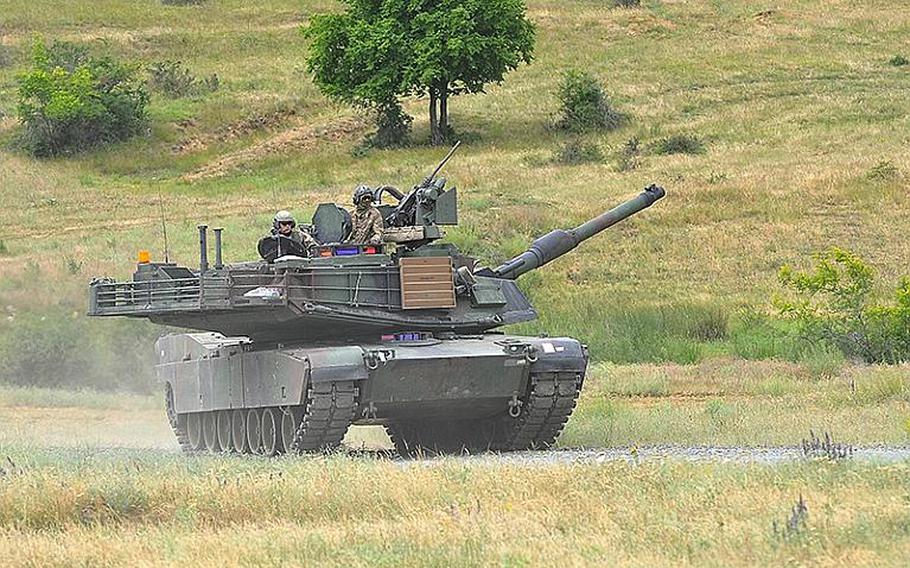 A U.S. Army M1A2 Abrams tank, manned by soldiers of the 3rd Combined Arms Battalion, 69th Armor Regiment,  rumbles across Novo Selo Training Area, Bulgaria, following a live-fire exercise that closed the Kabile 2015 tactical exercise at Novo Selo on Thursday, June 25, 2015. No service has  been affected more than the Army since Russia's 2014 intervention in Ukraine.