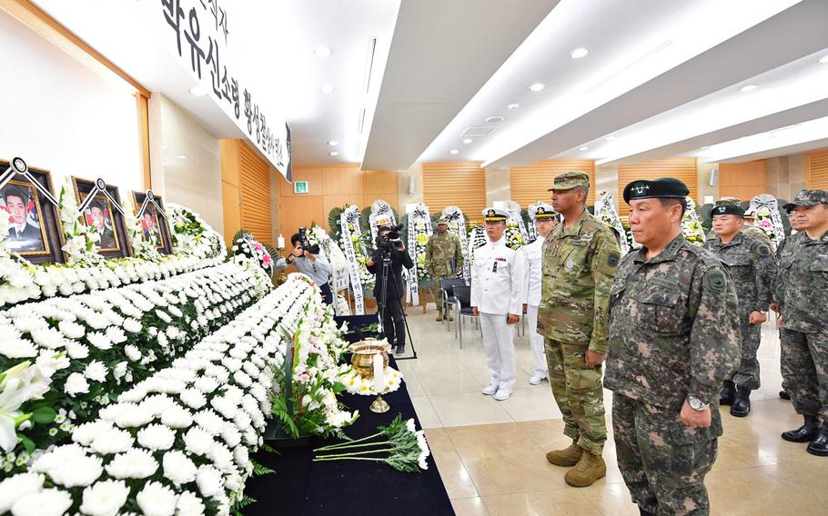 Army Gen. Vincent Brooks, commander of U.S. Forces Korea, the U.N. Command and the Combined Forces Command, and, to his left, South Korean Gen. Leem Ho-young, the newly appointed deputy commander for the Combined Forces Command, attend a wreath-laying ceremony on Friday, Sept. 30, 2016, for three South Korean sailors who died when their helicopter crashed. The crash occurred on Monday during a joint maritime operation in the Sea of Japan aimed at sending a warning to North Korea over its nuclear weapons program.