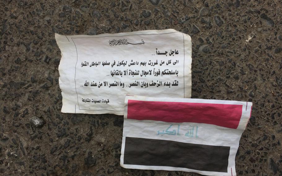 Leaflets seen near the outskirts of Mosul on Tuesday Nov. 1, 2016, urge locals who have been helping the Islamic State to turn on the group in exchange for the Iraqi government's forgiveness.