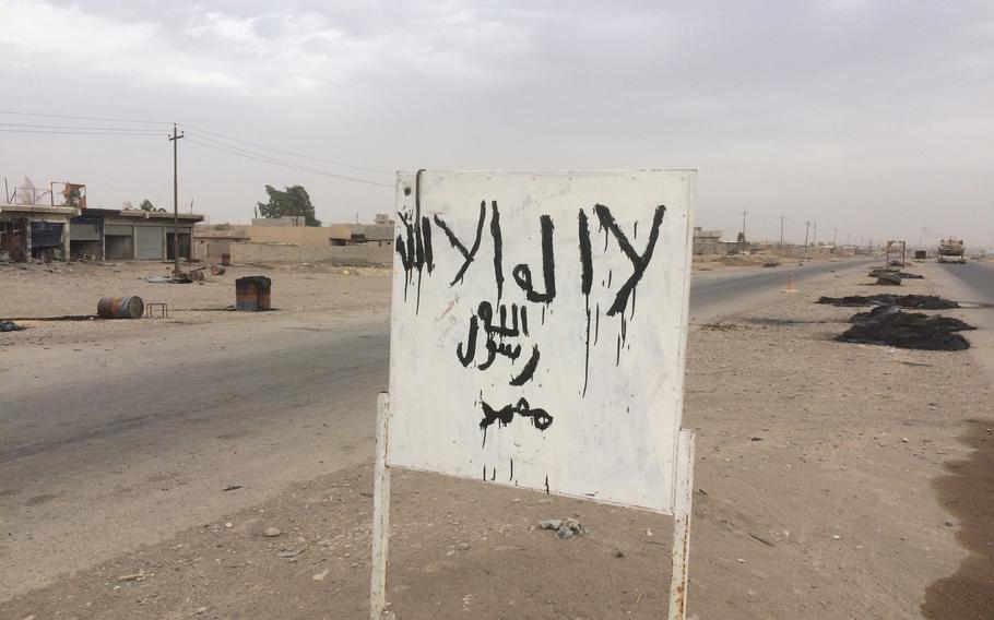 The Islamic State painted it's symbol on this sign by a road near Mosul, Iraq. The area was controlled by the Iraqi army on Tuesday Nov. 1, 2016.
