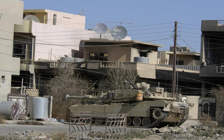 An Abrams tank with the Iraqi army's 9th Armored Division is situated near Mosul on Thursday, Nov. 3, 2016. The division entered the city limits briefly on Wednesday but later withdrew and were returning on Thursday, according to a general with the division.
