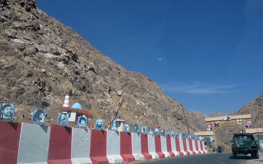 Photos of Panjshiri 'martyrs' killed in Afghanistan's nearly four decades of war line the blast walls near the entrance to the Panjshir Valley, pictured here on Oct. 13, 2016. The valley has been a bastion of resistance to the Taliban since the Islamist group took over the Afghan government in 1996.