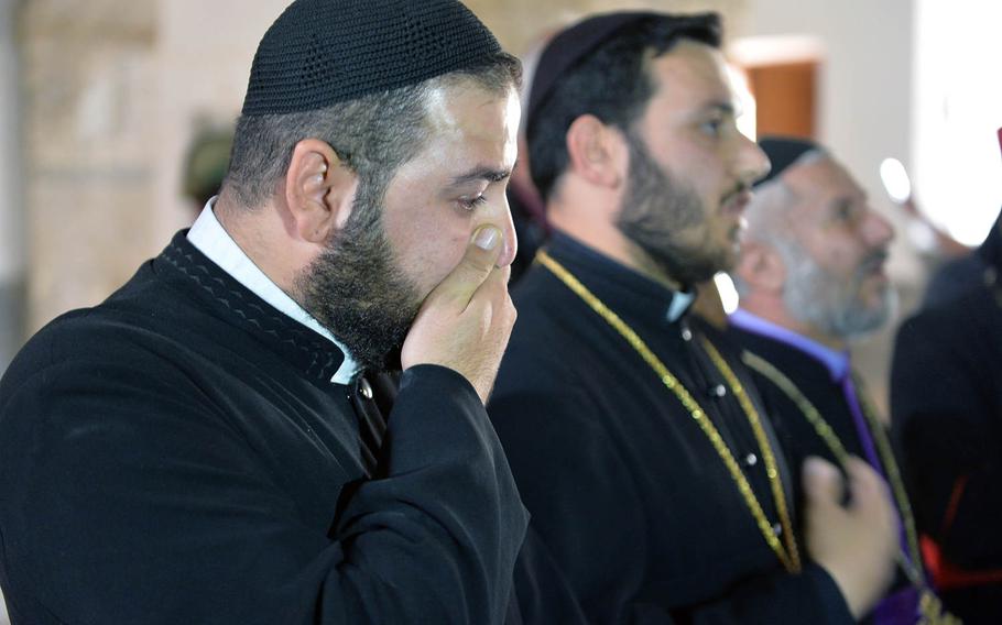 Rev. Safyan Yakub, a priest in the Syrian Orthodox Church, was shocked by the damage he witnessed at St. Shmoni Church in Bashiqa, Iraq, on Wednesday, Nov. 9, 2016. The nave and sanctuary were in disarray and covered in dirt and broken glass in the church where Yakub last said mass in 2014, shortly before fleeing when Islamic State fighters overran the town.