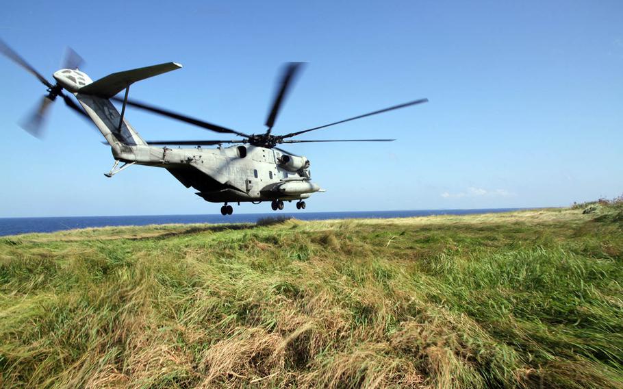 A CH-53E Super Stallion departs quickly after bringing Marines from India Company, 3rd Battalion, 3rd Marine Regiment to Ie Island, Japan, on Oct. 31, 2016. The Marines were dropped off on the island's margins so they could stealthily approach and seize an airfield from an enemy force during an exercise that was part of Blue Chromite 2017.