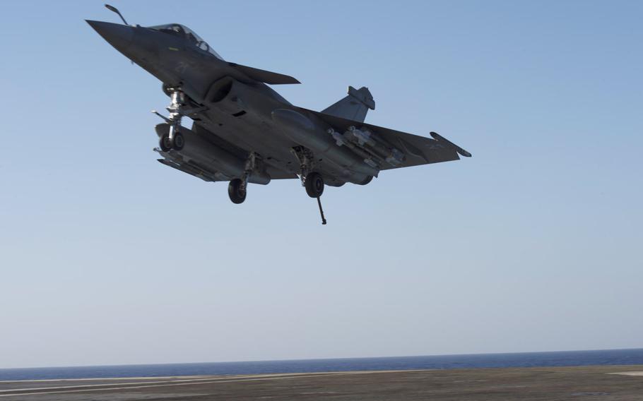 A multi-role Rafale M jet about to touch down on the French navy aircraft carrier Charles de Gaulle in the eastern Mediterranean on Nov. 25, 2016.  The Charles de Gaulle and its air wing are providing support for the U.S.-led coalition fighting the Islamic State group in Iraq and Syria.
