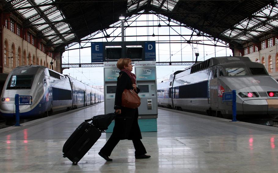 A passenger walks in Saint Charles railway station, in Marseille, southern France. (AP Photo/Claude Paris)