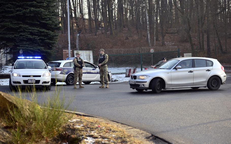 U.S. Army Military Police and Air Force Security Forces direct traffic away from the gate at Pulaski Barracks in Kaiserslautern, Germany, on Monday, Jan. 23, 2017. The gate was closed for several hours due to a unspecified security incident.