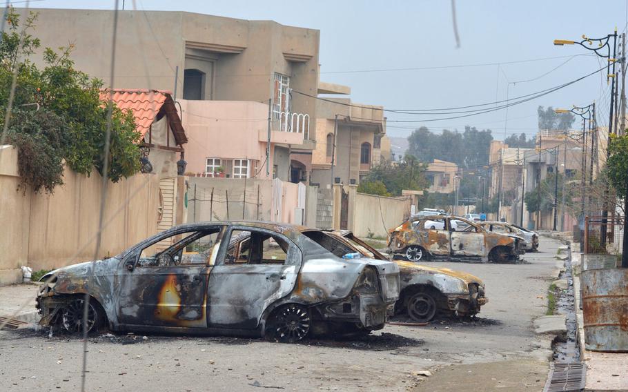 Residents of Mosul's al-Arabi neighborhood said Islamic State fighters forced them to burn their cars during a battle with Iraqi special forces troops on Jan. 20, 2017.