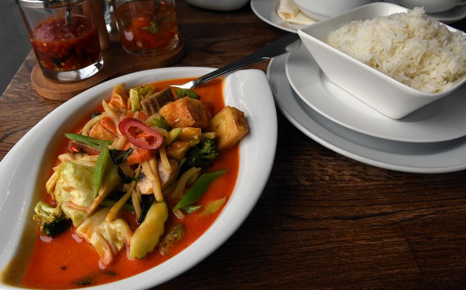 The vegetarian red curry dish at Alom Dee Thai restaurant and Japanese sushi bar in Landstuhl, Germany, was served with rice and was chock full of fresh vegetables and fried tofu.