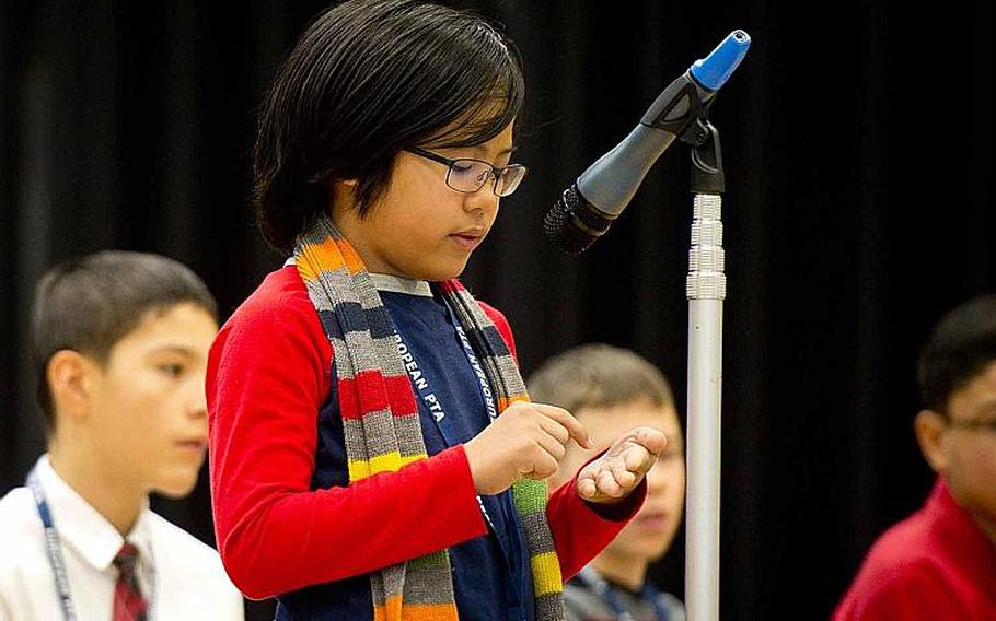 Ramstein Middle School's Ramon Padua Jr. spells a word on his hand during the 35th annual European PTA Spelling Bee at Ramstein Air Base, Germany, on Saturday, March 18, 2017.