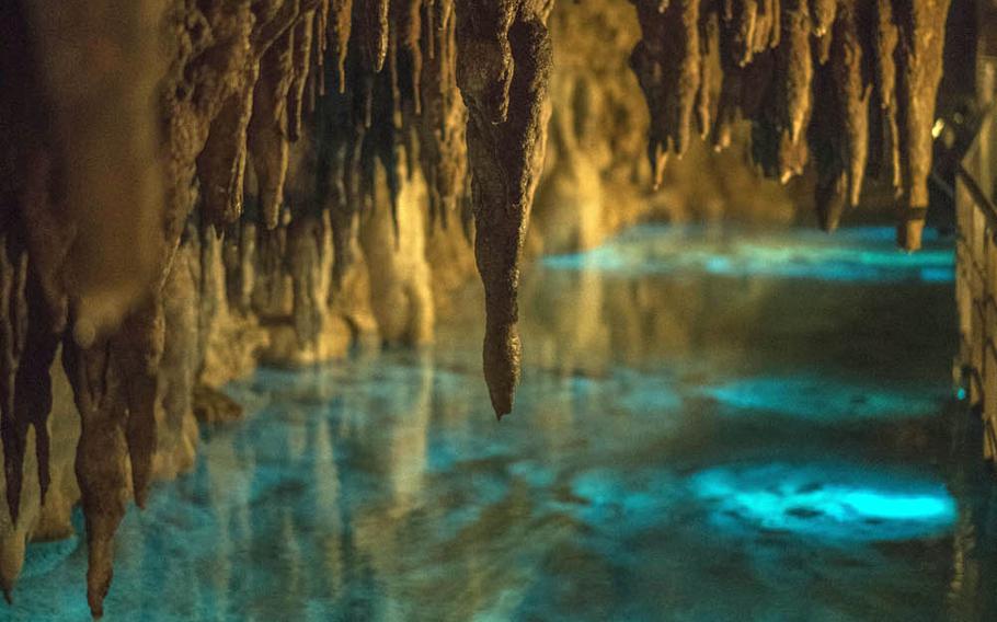 Strategically placed lighting gives water inside Okinawa's Gyokusendo Cave a rich blue color.