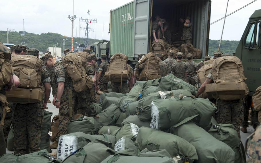 Marines assigned to the 31st Marine Expeditionary Unit load gear during an offload from the amphibious assault ship USS Bonhomme Richard at White Beach, Okinawa, Thursday, April 6, 2017.