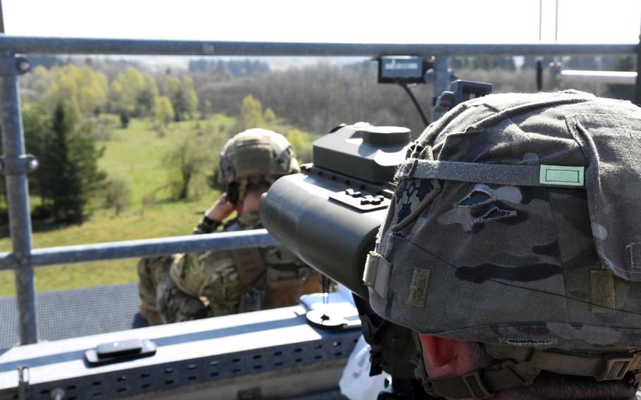 Soldiers with the Army's 3rd Armored Brigade observe artillery fire at the Grafenwoehr Training Area, Germany, during a combined-arms live-fire exercise, Monday, April 10, 2017, in preparation for training missions with allied forces.