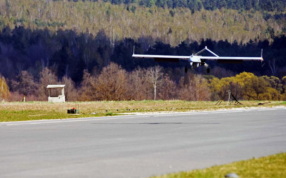 An AAI RQ07 Shadow unmanned aerial vehicle lands at the Grafenwoehr Training Area, Germany, during a combined-arms live-fire exercise, Monday, April 10, 2017. The UAVs were used to scout the area, observe and direct artillery fire.