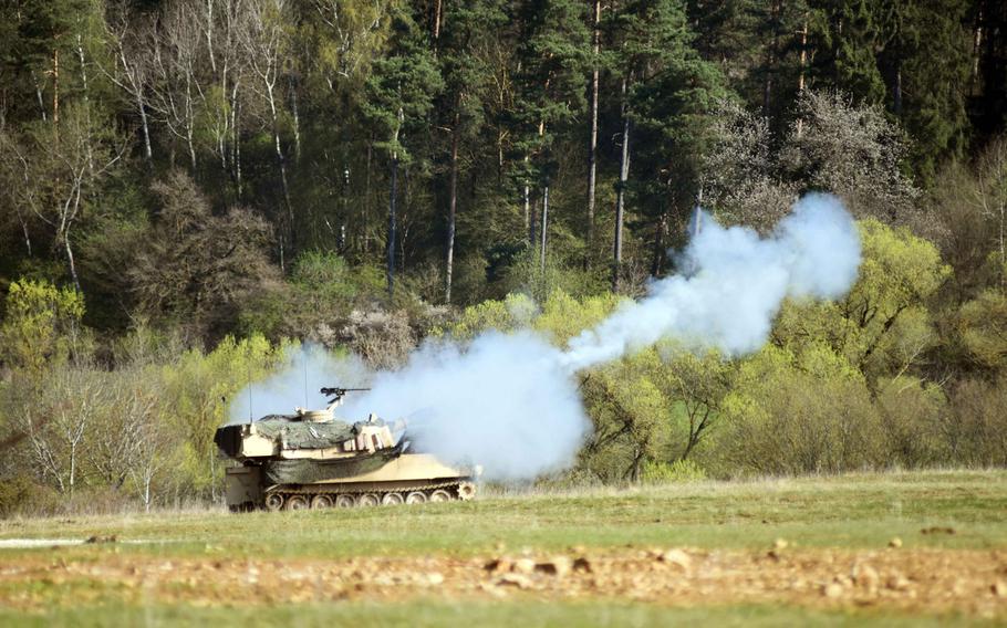 An Army M109 Paladin howitzer fires during a combined-arms live-fire exercise at the Grafenwoehr Training Area, Germany, Monday, April 10, 2017.
