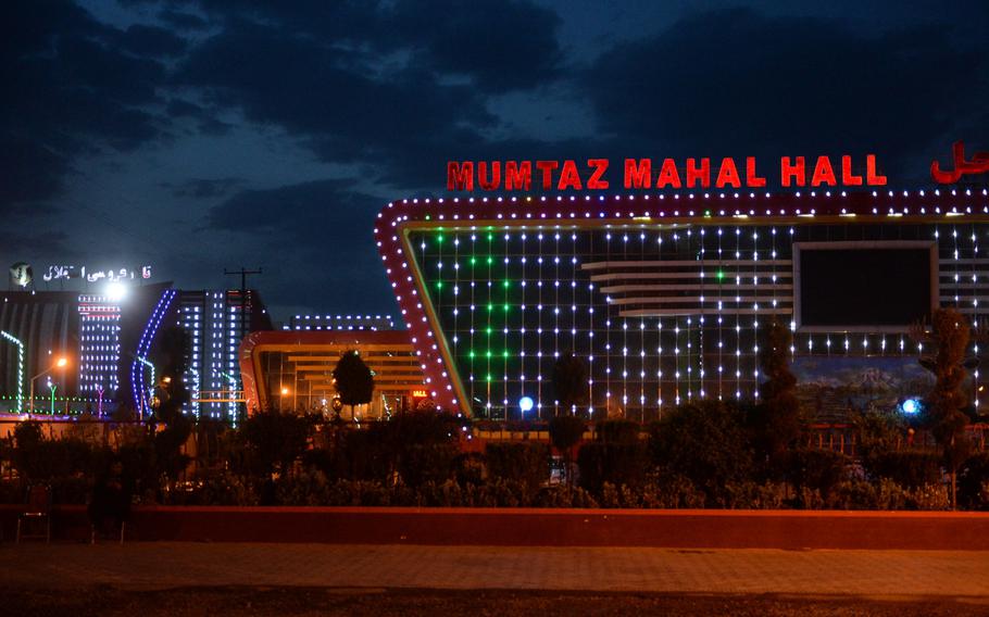 Mumtaz Mahal Hall turns on its lights on Tuesday, April 18, 2017. It is one of approximately 140 wedding halls that illuminate the Kabul skyline.