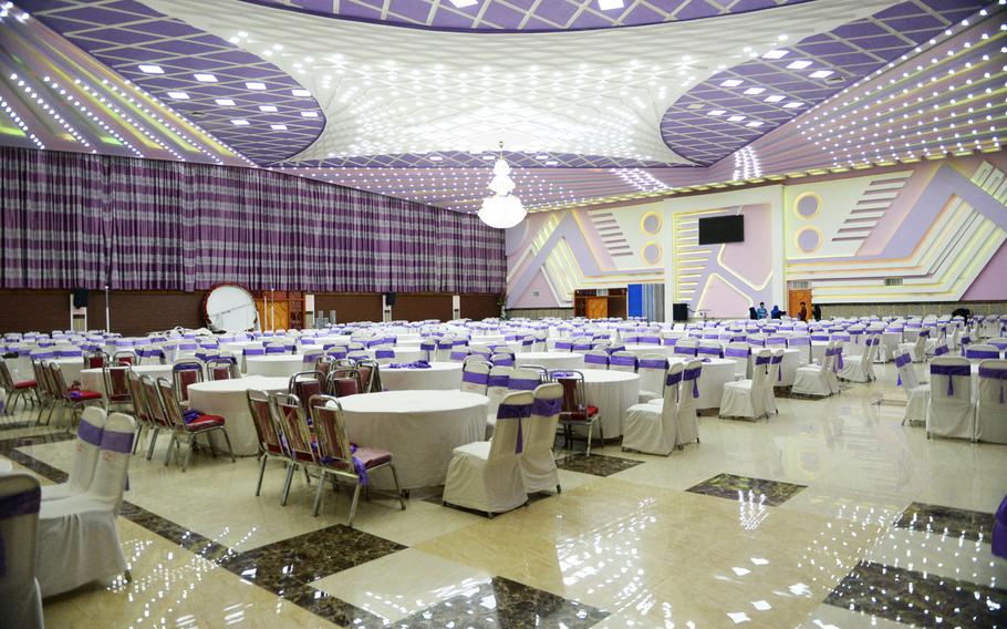 A large dining room at Atlantis Wedding Hall in Kabul a few hours before a celebration, April 5, 2017.