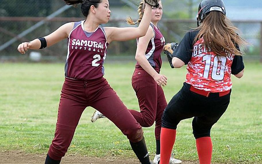 Matthew C. Perry's Kaede Goble is too late with the tag on E.J. King's Julianne Betancourt during Friday's DODEA-Japan softball tournament game. The Cobras beat the Samurai 11-8 in the quarterfinal, then Yokota 17-7 in the semifinal to reach Saturday's championship game against Kinnick.