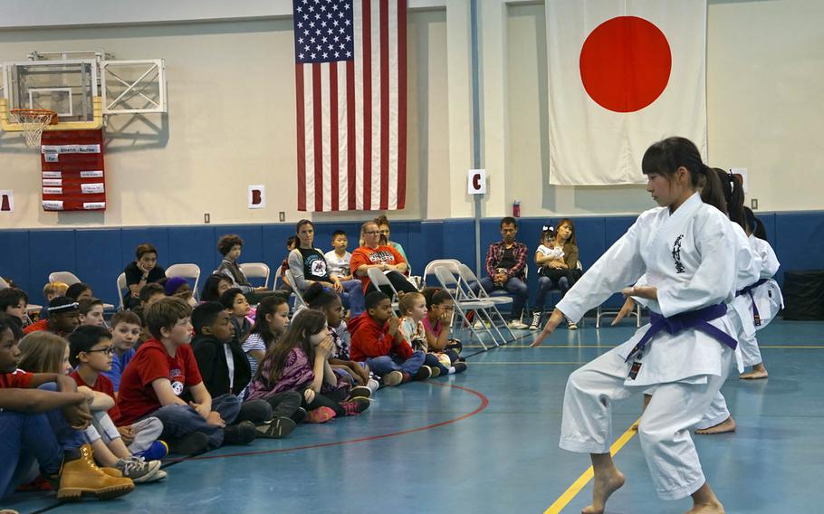 Students at Joan K. Mendel Elementary School at Yokota Air Base, Japan, watch karate students perform an advanced kata during the school's JaPANDAsia cultural festival, Friday, May 5, 2017.