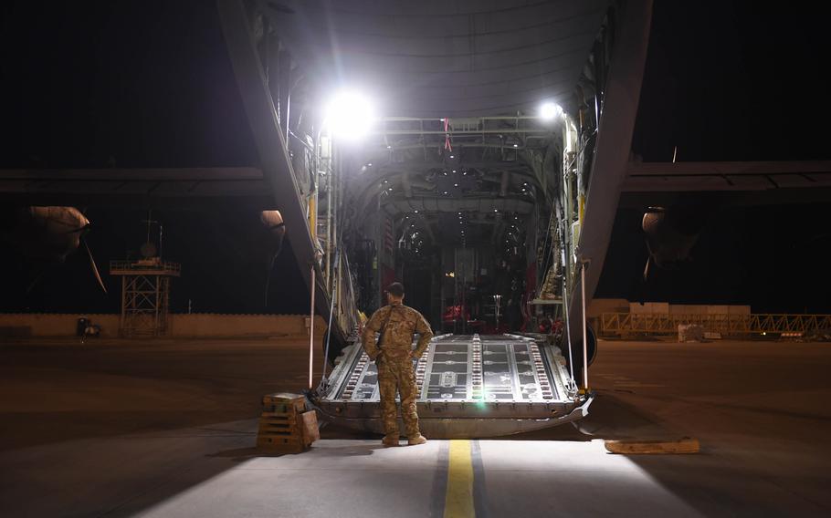 Capt. Brennan Wolford, 29, of Thornville, Ohio, waits for cargo to be loaded onto a C-130J from the 774th Expeditionary Airlift Squadron at Mazar-e-Sharif, Afghanistan, May 4, 2017.