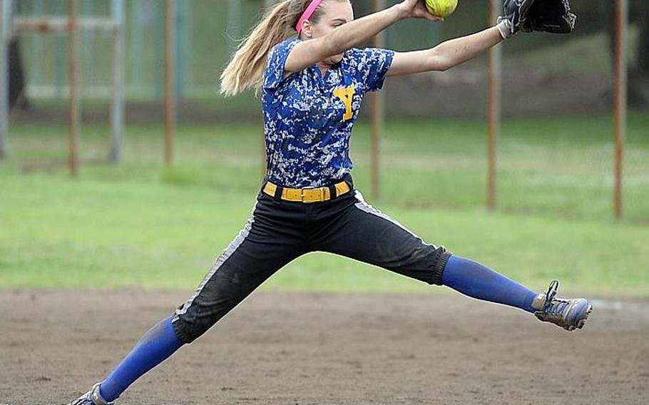 Yokota right-hander Ashley Woodruff lets fly against E.J. King during Tuesday's triple-elimination game in the Far East Division II Softball Tournament. The Panthers edged the Cobras 15-14 to keep hope for their third straight title alive.

DAVE ORNAUER/STARS AND STRIPES