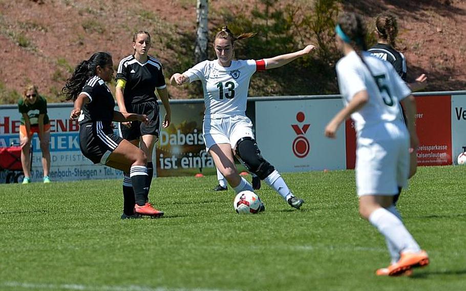 SHAPE's Quinn Kilrain tries to get past Vicenza's Angelina Yepez in Division I action at the DODEA-Europe soccer championships in Reichenbach, Germany. SHAPE won the game 3-0.