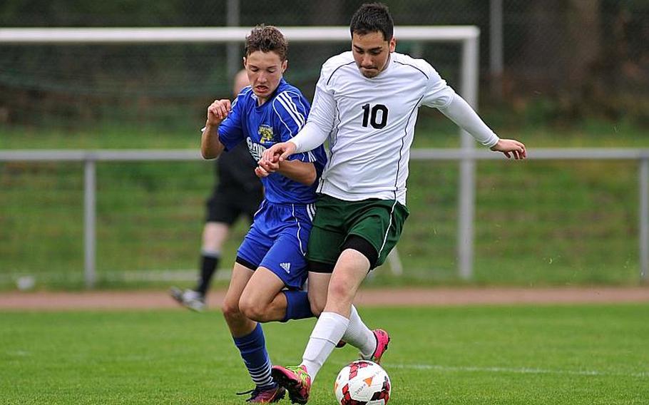 Sigonella's Kylen Jones, left, and Alconbury's Devon Anderson battle for the ball in Division III action at the DODEA-Europe soccer championships in Landstuhl, Germany. Sigonella won 3-0.