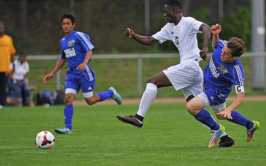 Ansbach's Kevin Kamara gets away from Sigonella's Aaron Jacobs on his way to scoring a goal in Division III action at the DODEA-Europe soccer championships in Landstuhl, Germany. The game ended 2-2 and Ansbach won two points by taking the shootout 4-2.