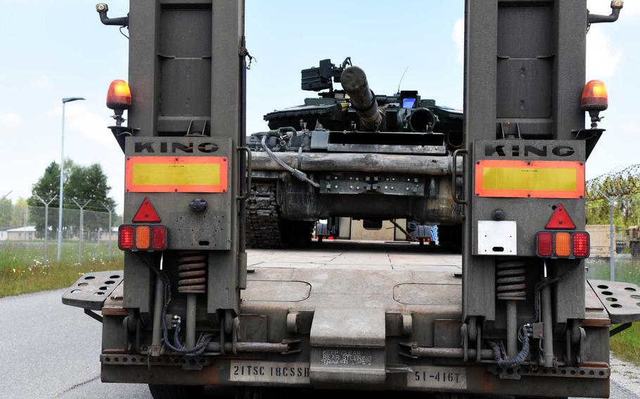 A Ukrainian T-64 tank being transported in a British Heavy Equipment Transporter being driven by American soldiers at Grafenwoehr, Germany, Tuesday, May 23. A Ukrainian tank platoon will be taking part in Exercise Combined Resolve.